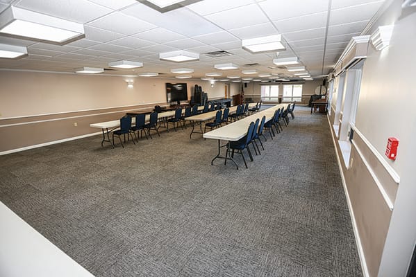 Common area of a senior living facility with tables and chairs