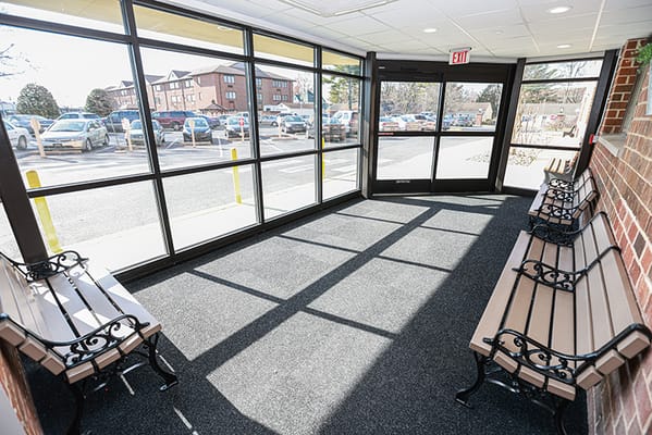 Bright interior hallway with benches and large windows