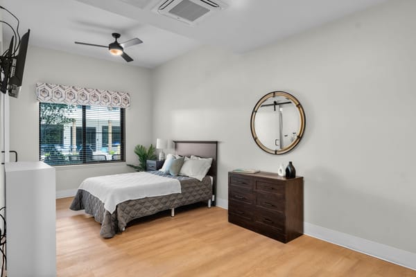 Cozy private bedroom with natural light