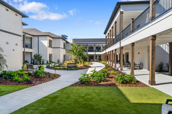 Beautiful landscaped courtyard with pathways and seating areas