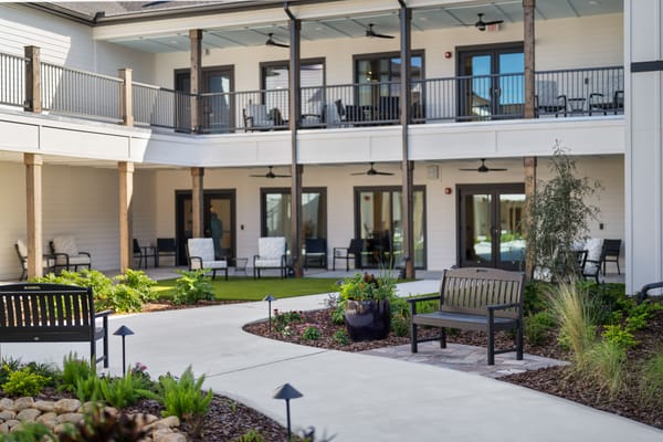 Beautiful outdoor courtyard with seating and greenery