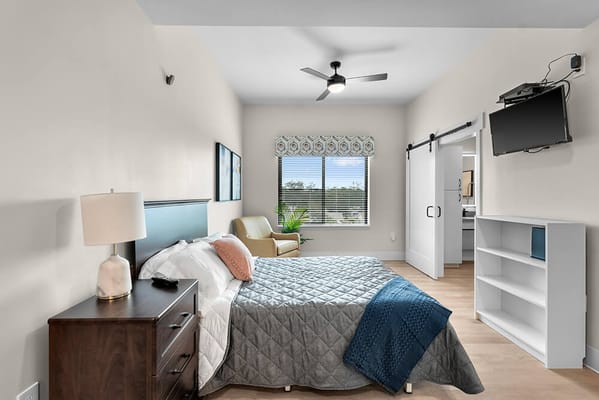 Bright interior of a private resident room with furnishings