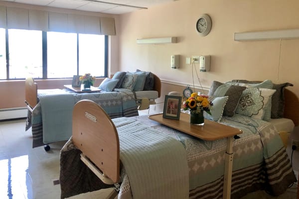 A cozy shared room with two beds and decorations