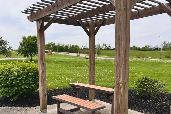 Outdoor pavilion with seating area in a garden