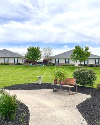 Beautiful outdoor space with grassy area and seating