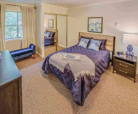 Cozy resident bedroom with warm lighting and decor