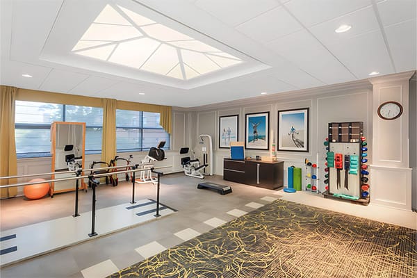 Well-equipped fitness room with exercise machines