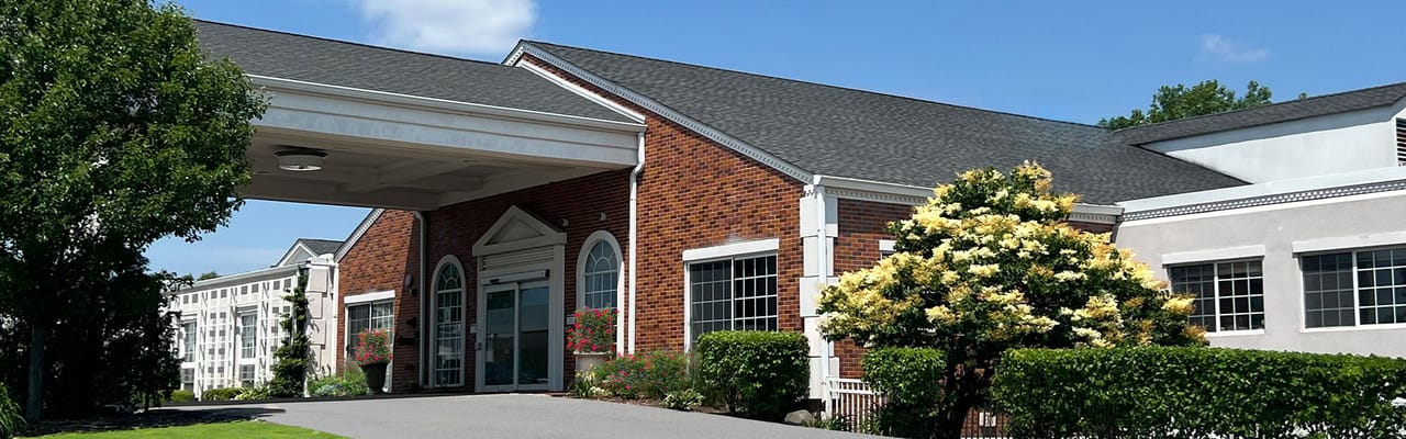 Building exterior of Avantara Long Grove with landscaping