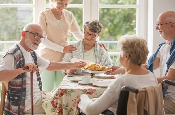 Residents enjoying food in a common area