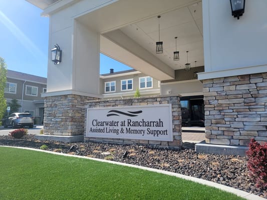 Entrance sign for Clearwater at Rancharrah with grassy area in front