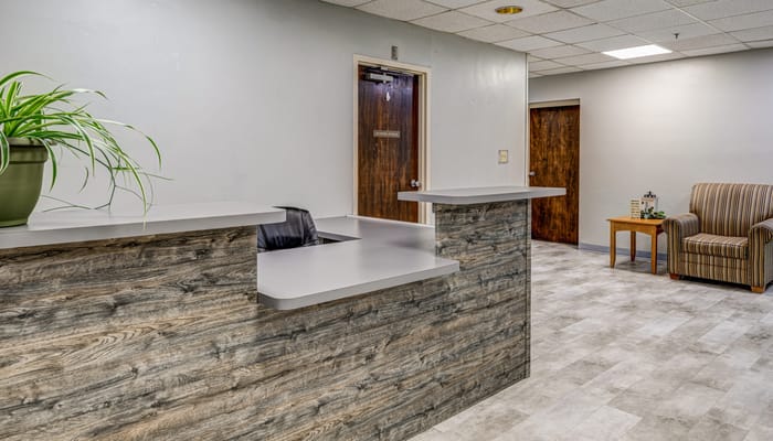 Reception area of the facility with a desk and chair