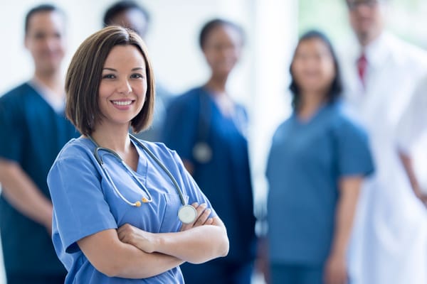 Healthcare staff smiling in a well-lit environment