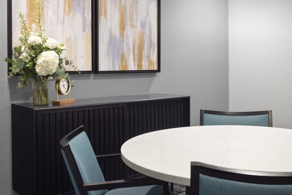 Elegant interior space with floral arrangement and artwork