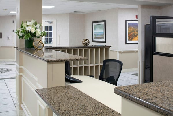 Reception area with seating and floral decor