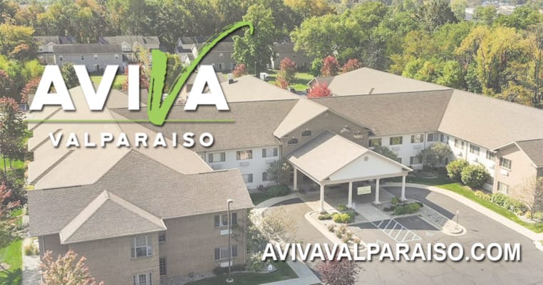 Aerial view of the nursing home facility with logo