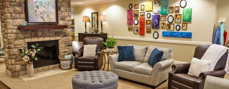 Cozy common area with comfortable seating and art on the wall
