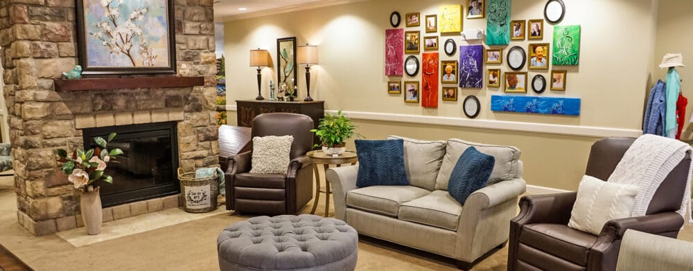 Cozy common area with comfortable seating and art on the wall
