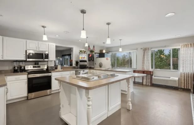 Bright kitchen with modern appliances and large windows