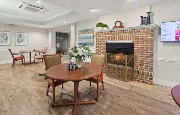 Well-furnished common area with a cozy fireplace