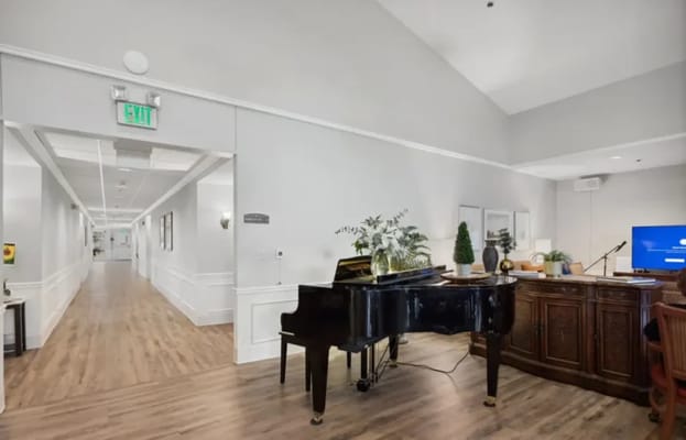 Interior view of a common area with a piano