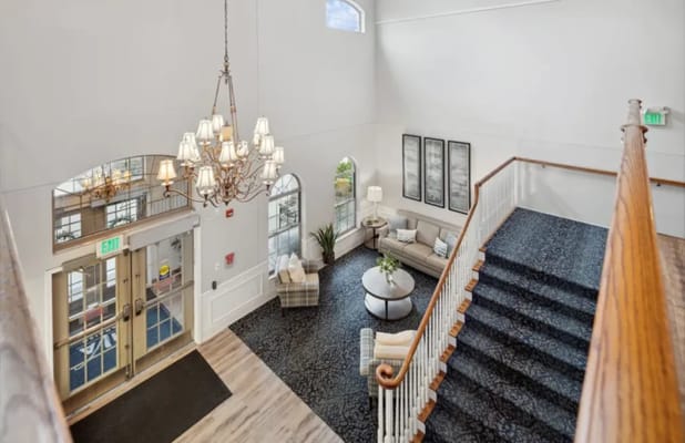 Bright interior lobby with seating and chandelier