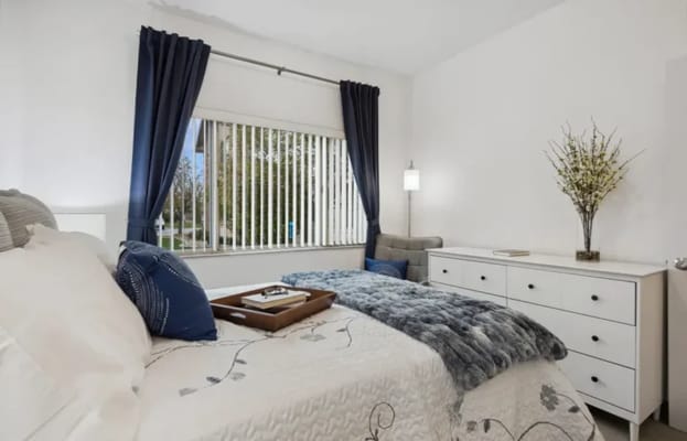 A well-furnished private resident room with natural light