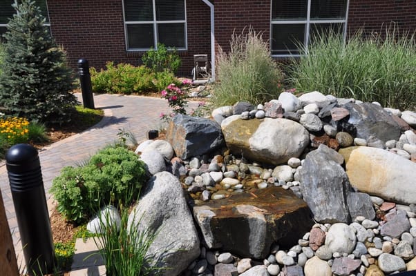 Landscaped outdoor area with rocks and plants