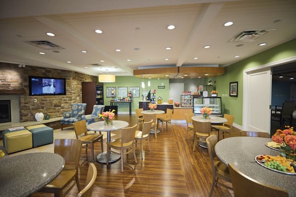Interior of a common area with tables and decor