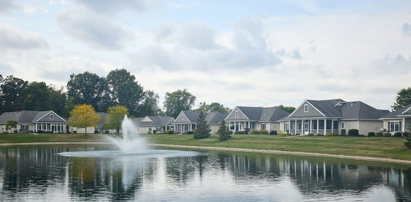 Outdoor view of residential buildings beside a pond