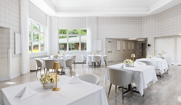 Elegant dining room with tables and flowers