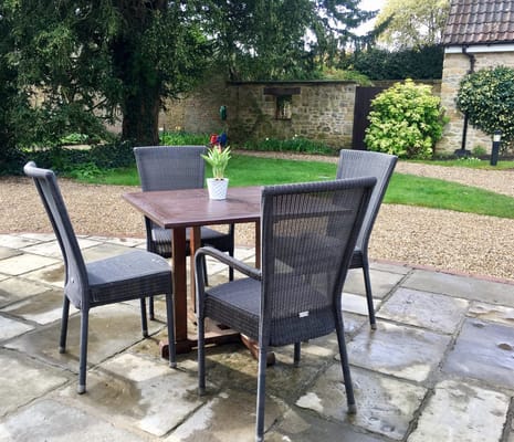 Outdoor seating area with a table and chairs