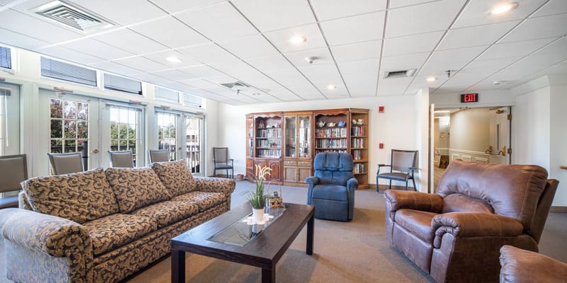 Cozy common area with seating and bookshelves