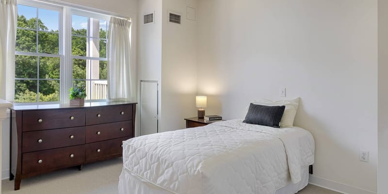 Cozy private resident room with light-colored furnishings