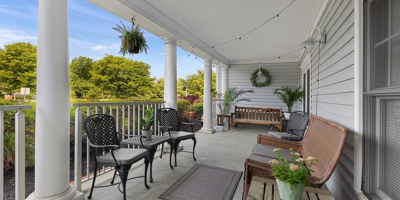 Outdoor seating area with plants and decorative features