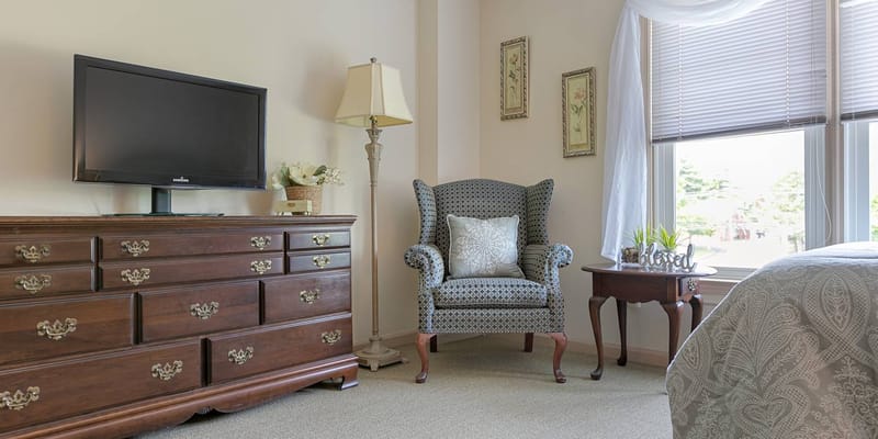 Cozy resident room with furniture and natural light