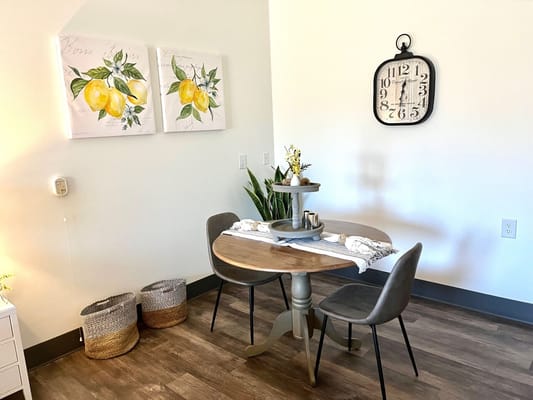 Cozy dining area with lemon artwork
