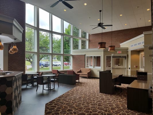 Interior view of a common area with large windows