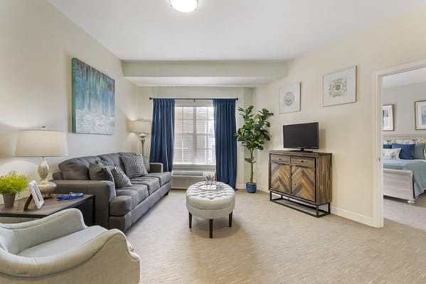 A cozy interior of a resident room with furniture