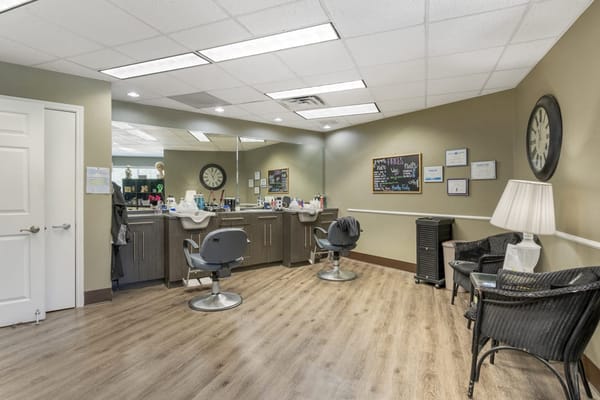 Facility hair salon with styling chairs and decor