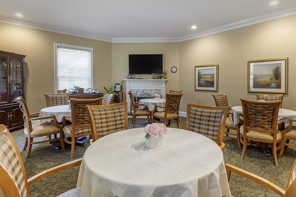 Bright dining area with tables and chairs