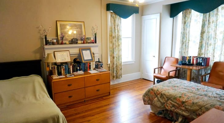 Interior room with twin beds and a bookshelf