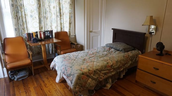 Cozy resident room with bed and seating area