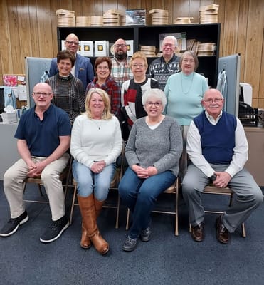 Staff and residents posing together in a common area