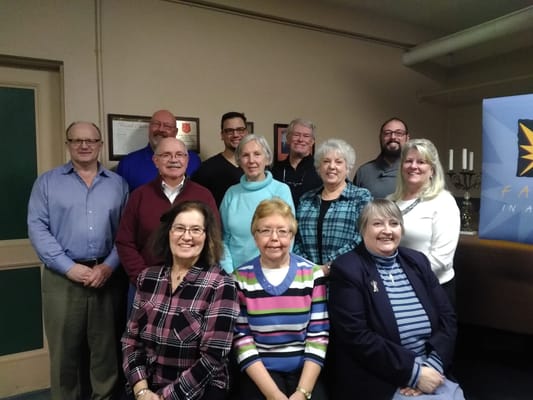 Group photo of staff and members at facility event