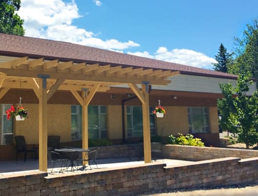 Outdoor patio area with seating and flowers