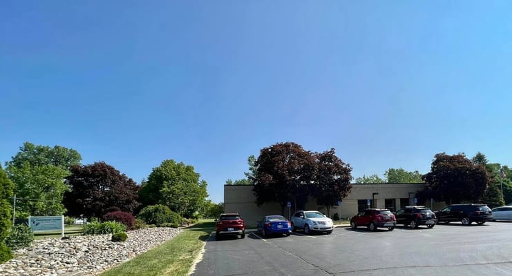 Exterior view of Frenchtown Center for Active Adults with parking area