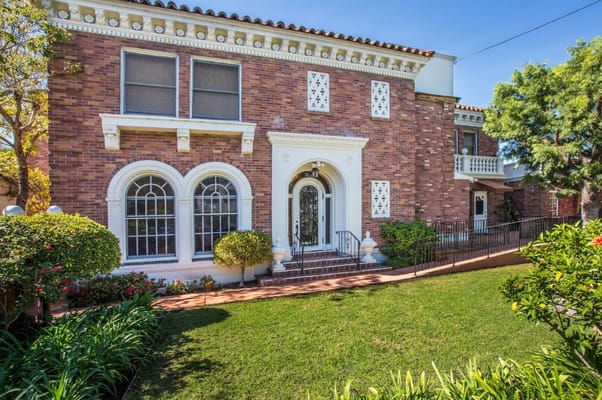 Front view of HarborView Senior Assisted Living facility with landscaped garden