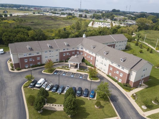Aerial view of Heritage Woods of Rockford showing the building and parking area.