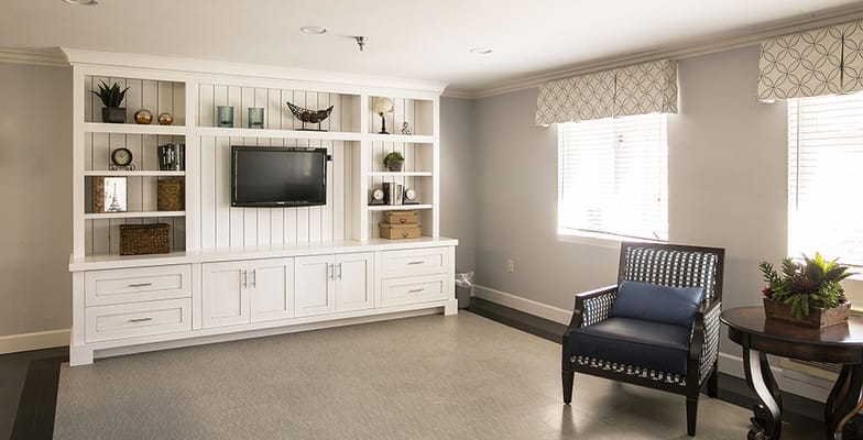 Bright common area with a TV and seating