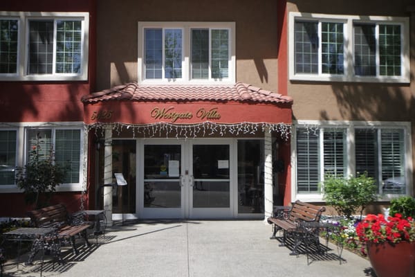 Exterior view of Westgate Villa entrance with landscaping